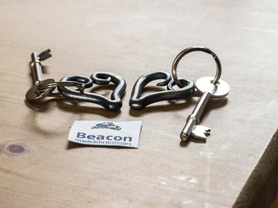 Keys on a wooden surface with a tag at Beacon Cottage Ilkley