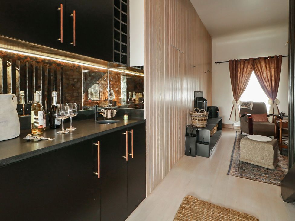 A snug area with a bar counter and seating at Hanowen House, Dungloe, County Donegal