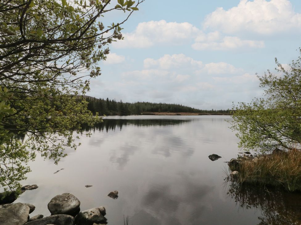 A body of water surrounded by trees and rocks at Hanowen House Dungloe, County Donegal