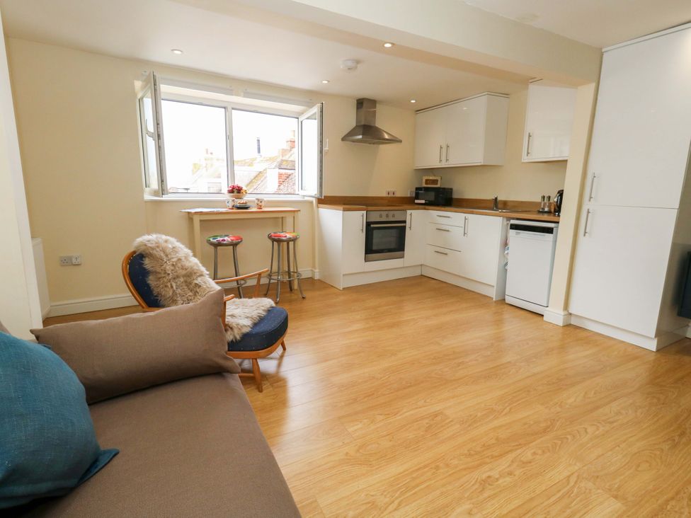 A kitchen with stove and sink at Flat 3
