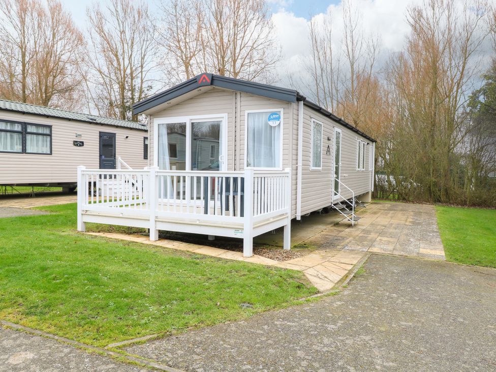 A caravan with a porch and stairs at Caravan in Great Yarmouth
