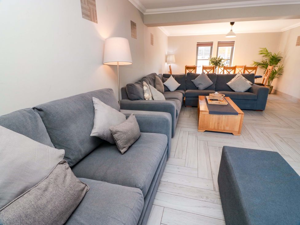 A living room with sofas and a coffee table at Ledrishmore View in Alexandria
