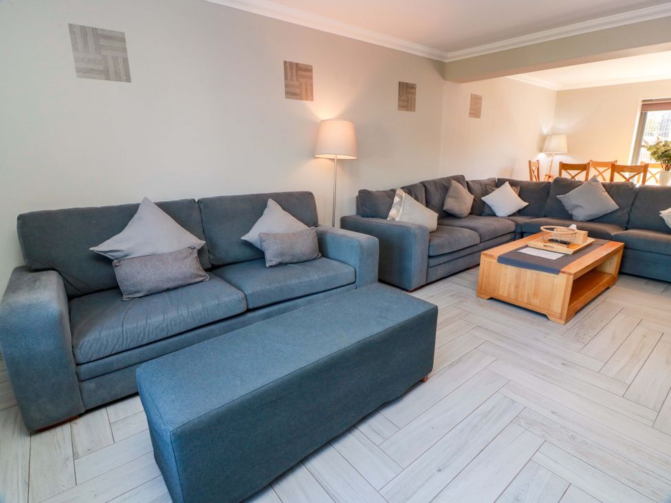 A living room with sofas and a coffee table at Ledrishmore View in Alexandria