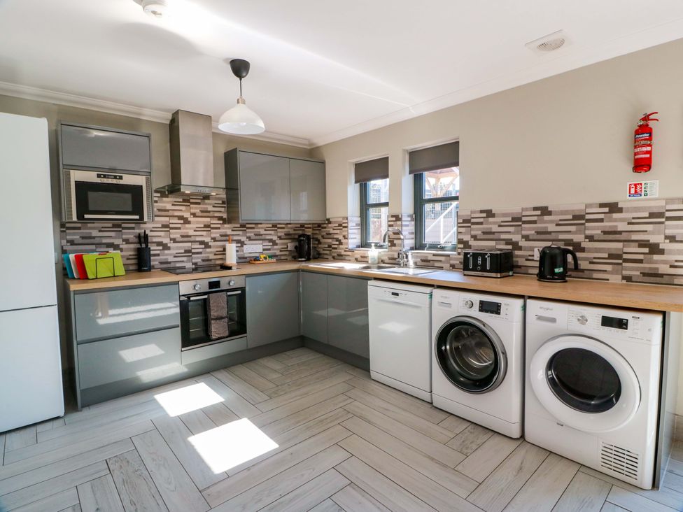 A kitchen with appliances and countertop at Ledrishmore View Alexandria