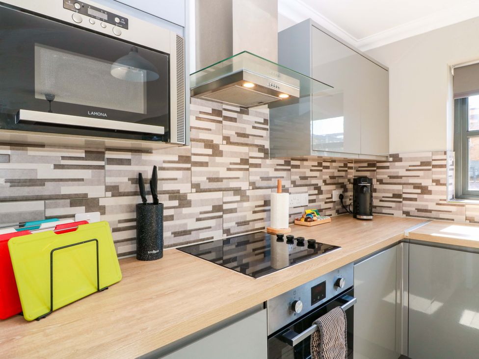 A kitchen with a microwave and cooktop at Ledrishmore View in Alexandria