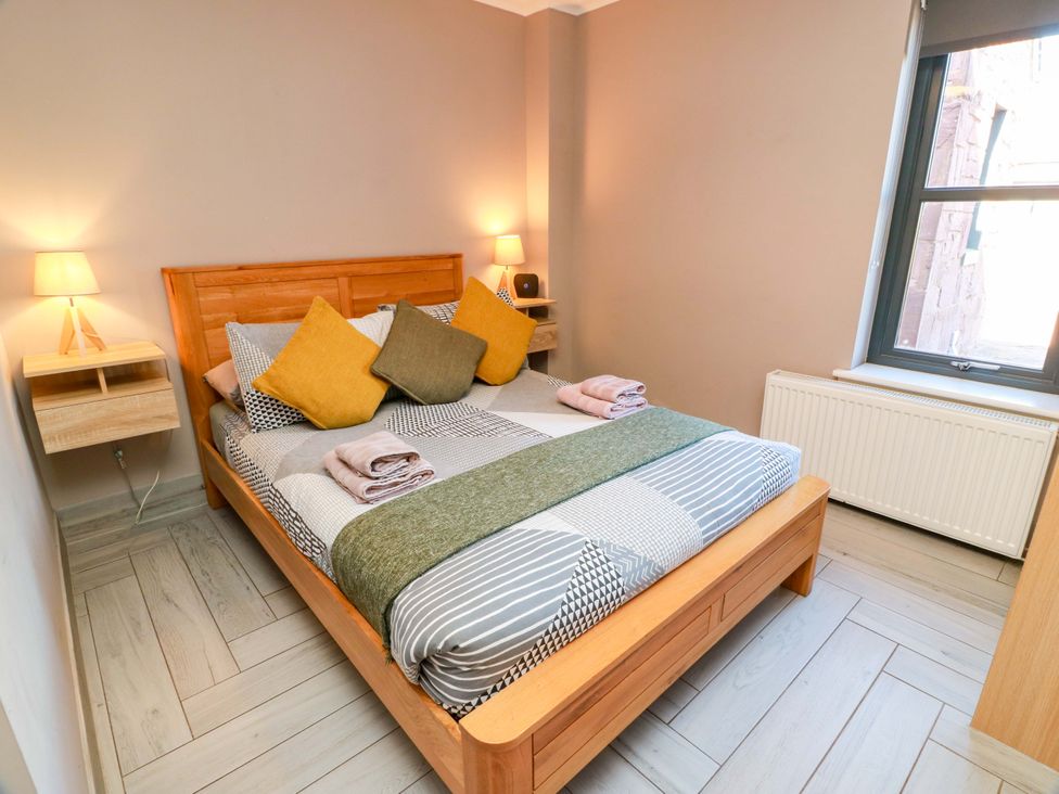 A bedroom with a bed and bedside tables at Ledrishmore View in Alexandria