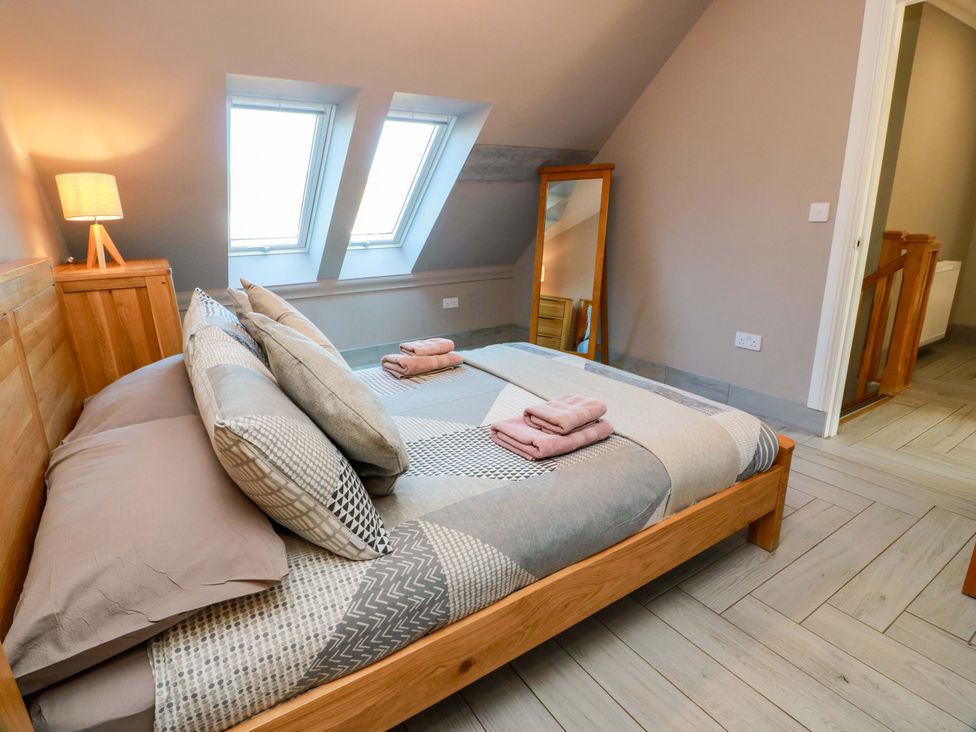 A bedroom with a bed and lamp at Ledrishmore View in Alexandria