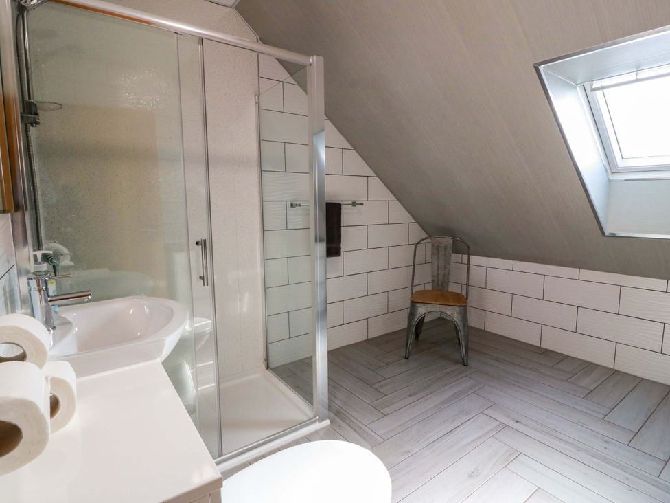 A bathroom with a shower and sink at Ledrishmore View in Alexandria