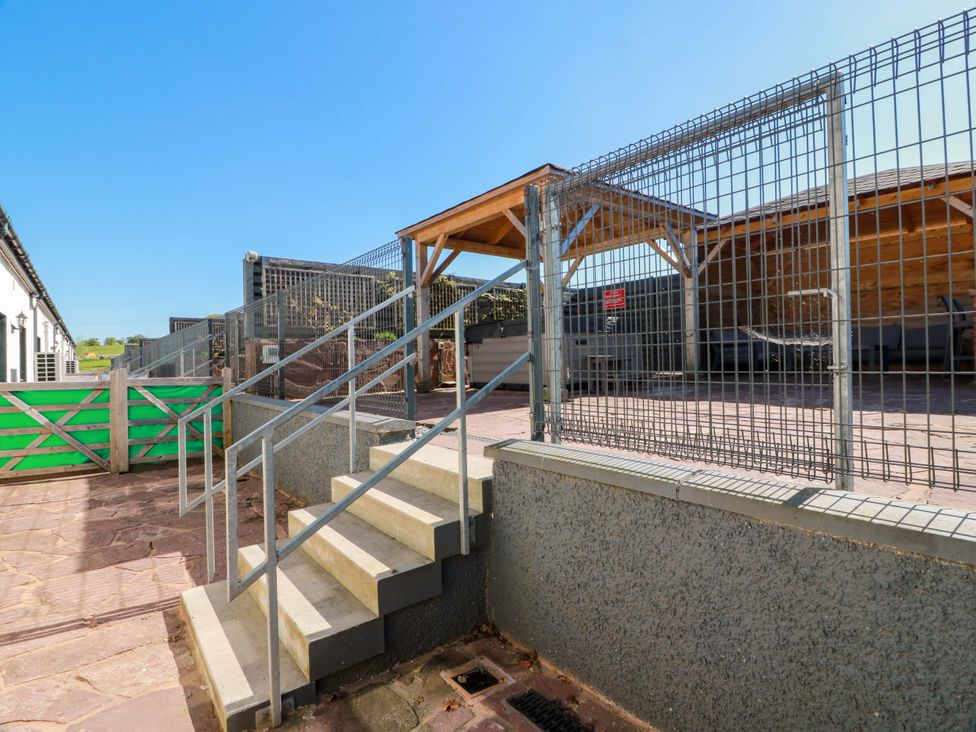 An outdoor area with stairs and fenced shelter at Ledrishmore View Alexandria