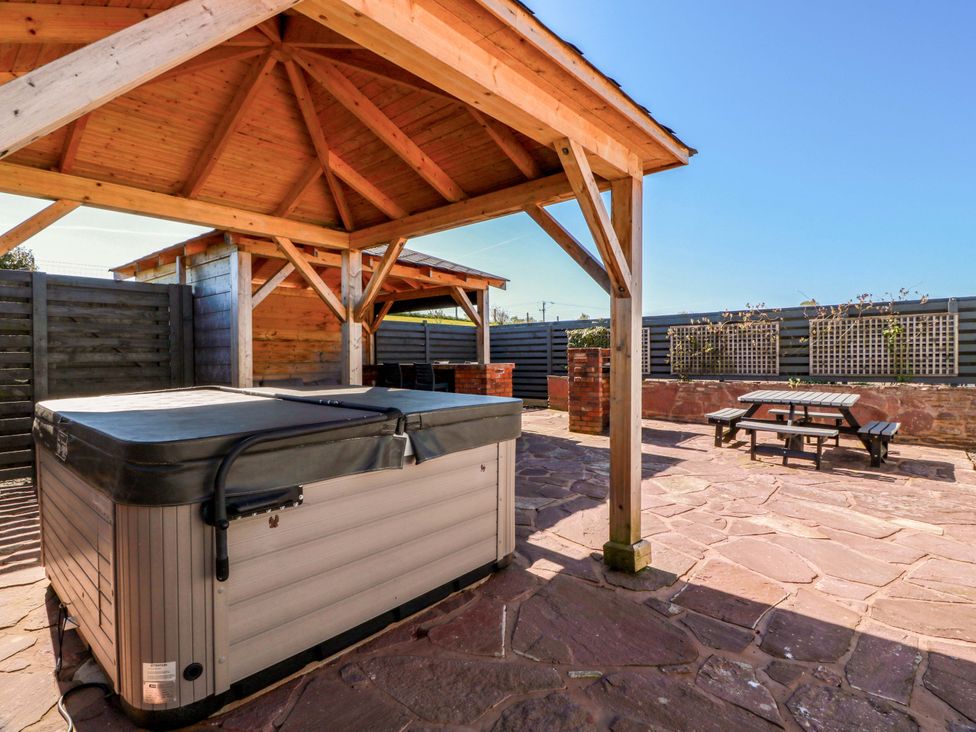 An outdoor area with a hot tub and gazebo at Ledrishmore View in Alexandria