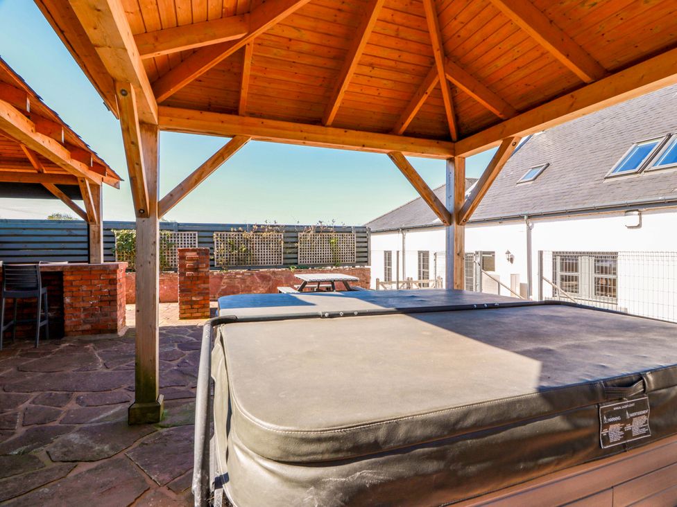 An outdoor area with a hot tub and gazebo at Ledrishmore View in Alexandria