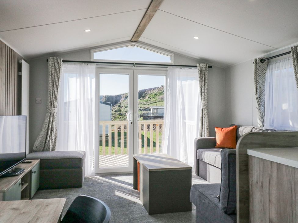 A living room with a sofa and coffee table at Willerby High End Brand S6 (on Coniston) St Bees