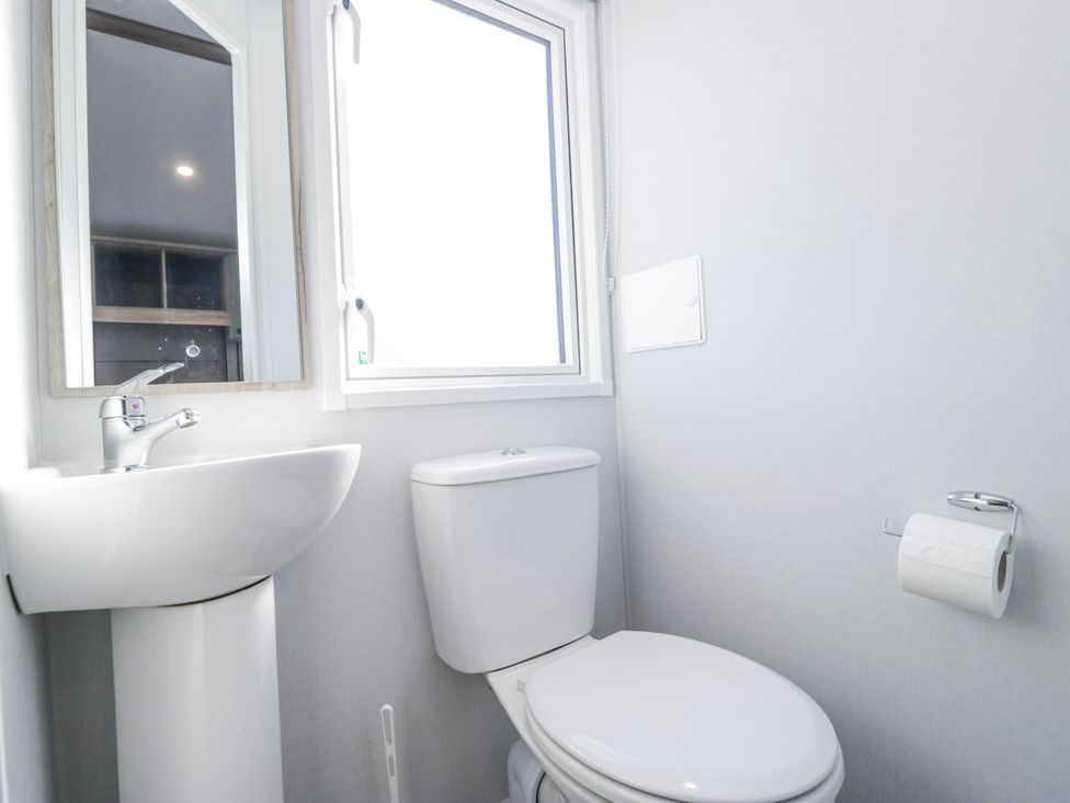 A bathroom with a sink and toilet at Willerby High End Brand S6 (on Coniston) St Bees