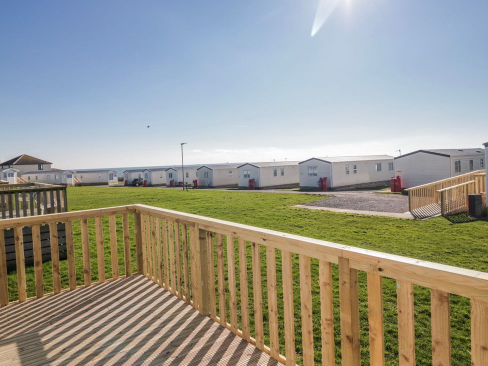 A view of caravans and open green space at Willerby High End Brand S6 (on Coniston) St Bees