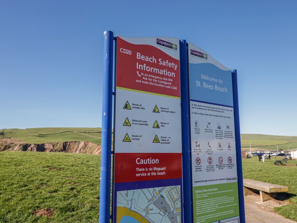 A beach safety information sign at St. Bees Beach