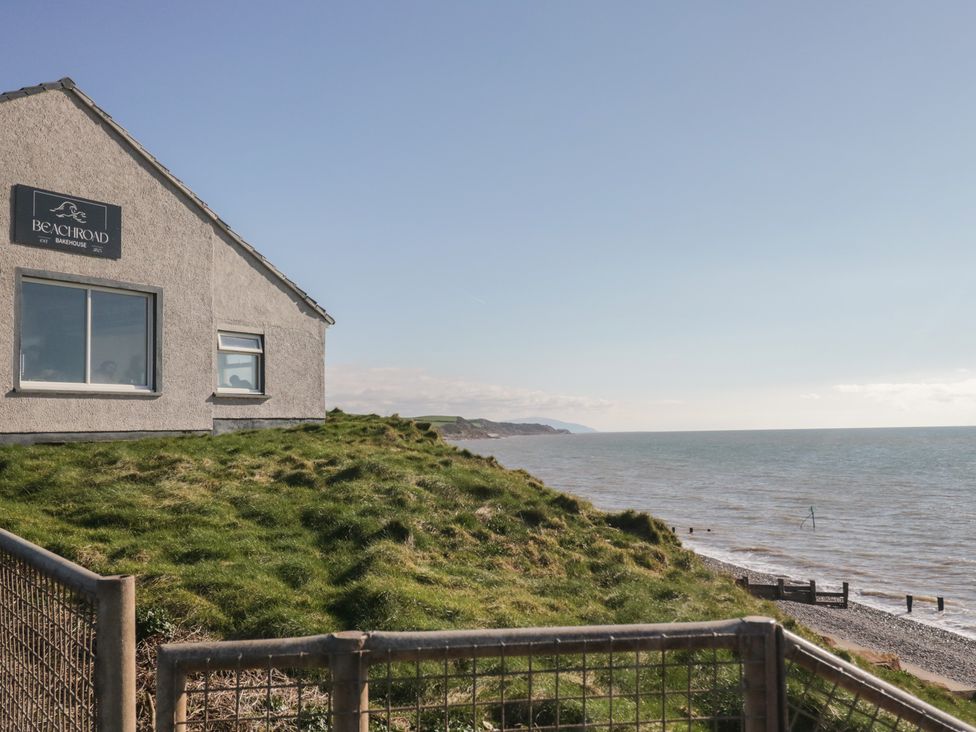 A house by the sea with a sign at Beach Road in St Bees