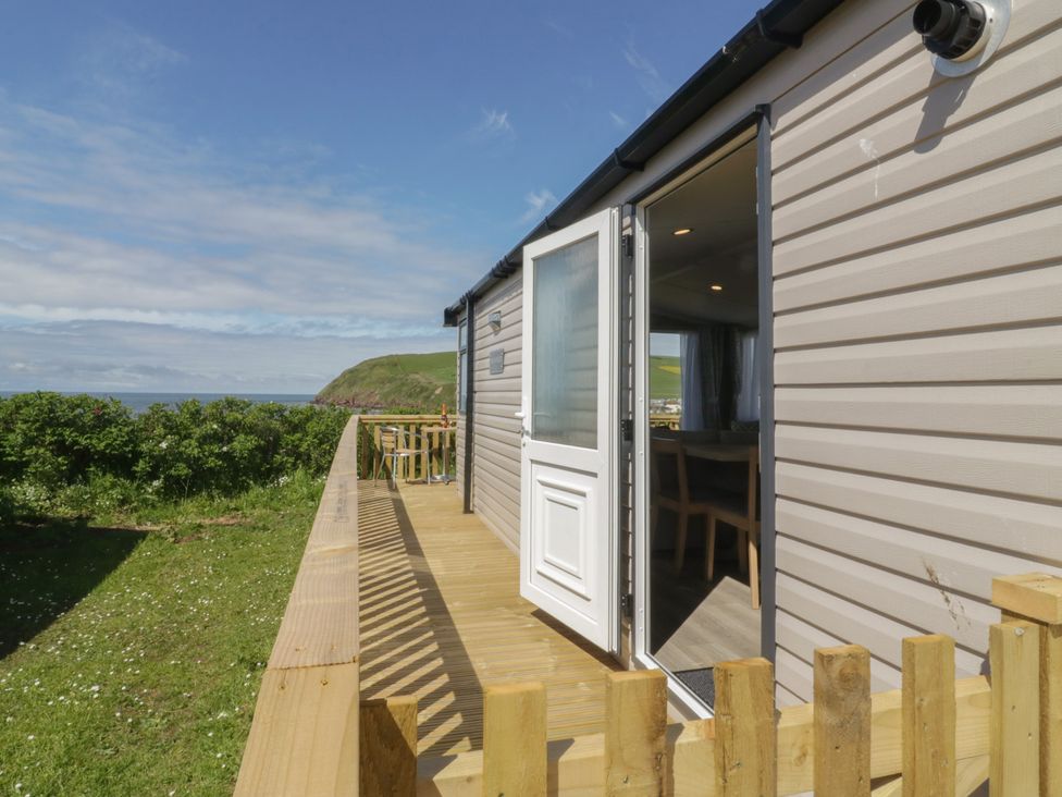 A house with a deck and view of the sea at The Swift St Bees