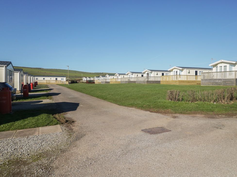 A row of static caravans along a road at Swift Brand (3 Bed) (on Coniston) St Bees