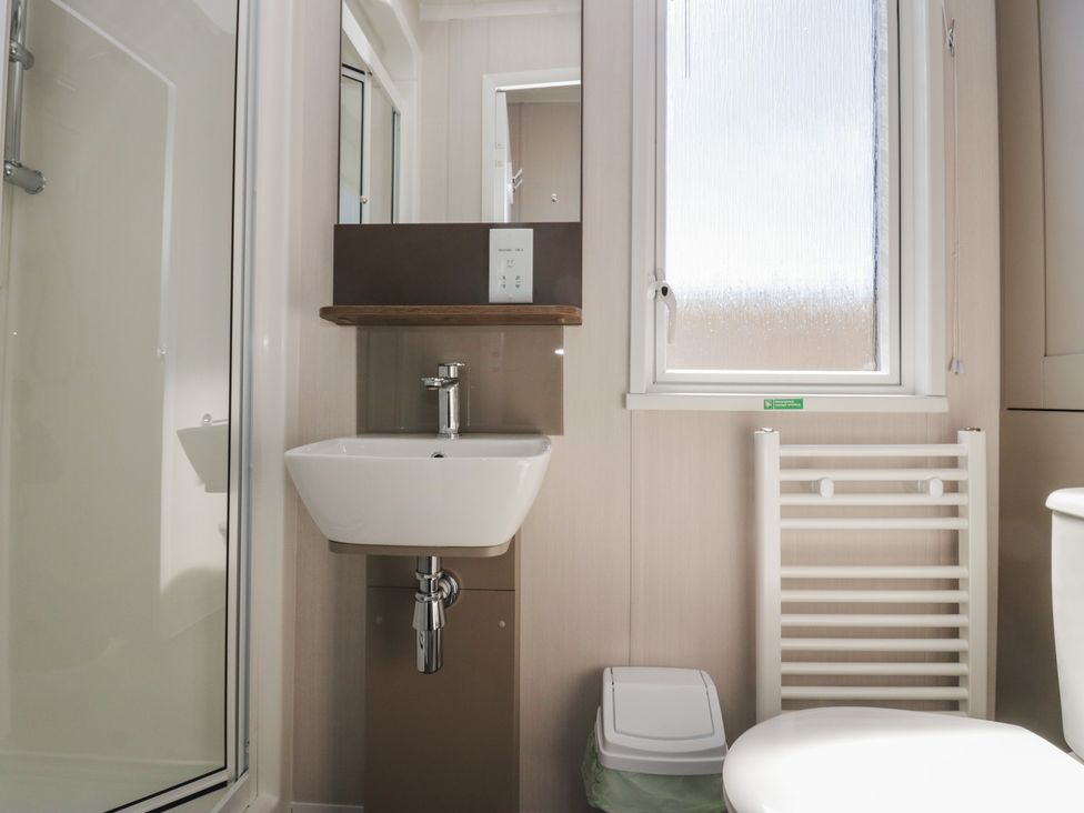 A bathroom with a sink and toilet at The Plover in St Bees