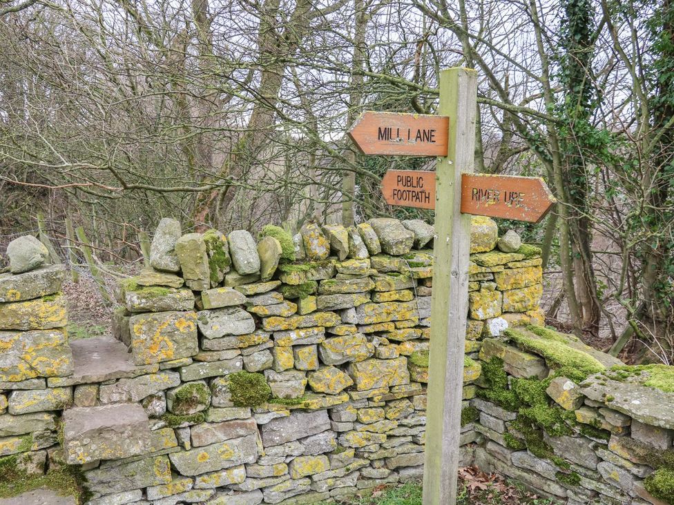 A signpost indicating directions at The Bothy in Leyburn