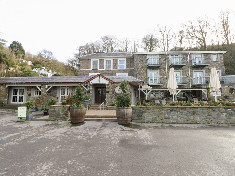 An outdoor view of a stone building entrance at Under cliff caravan in Ferryside