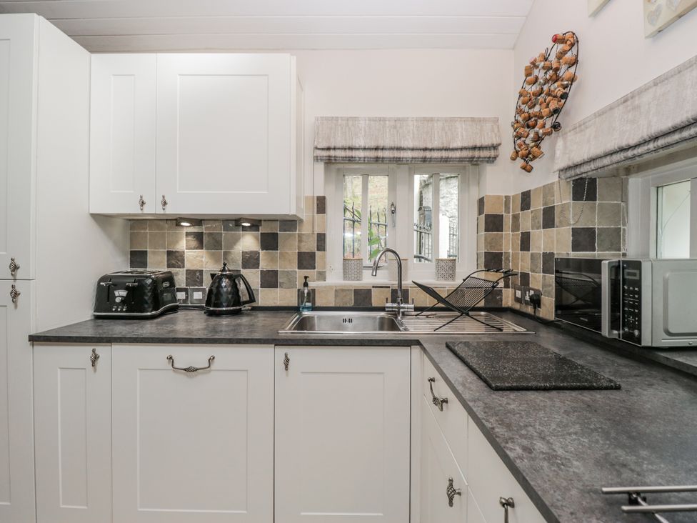 A kitchen with countertop and appliances at The Dove Cot in Ambleside