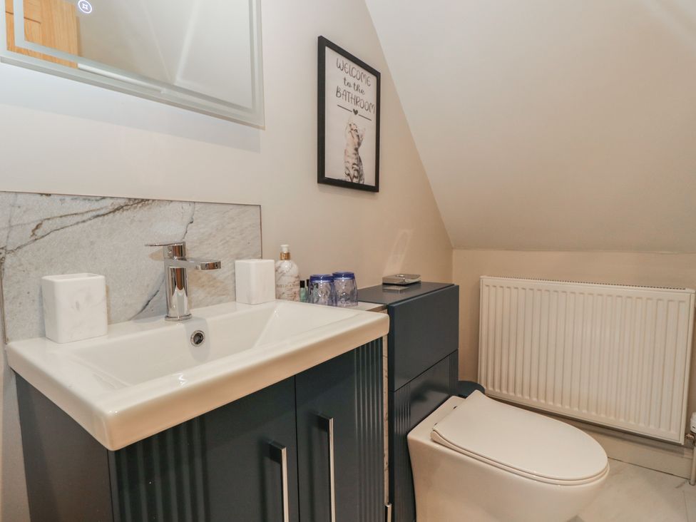 A bathroom with a sink and toilet at Paddock View in Stow-On-The-Wold