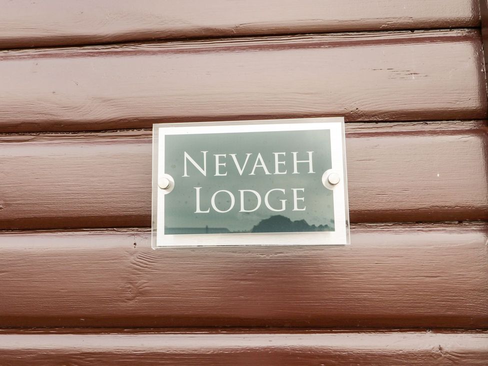 A sign displaying Nevaeh Lodge at Nevaeh Lodge in Longframlington