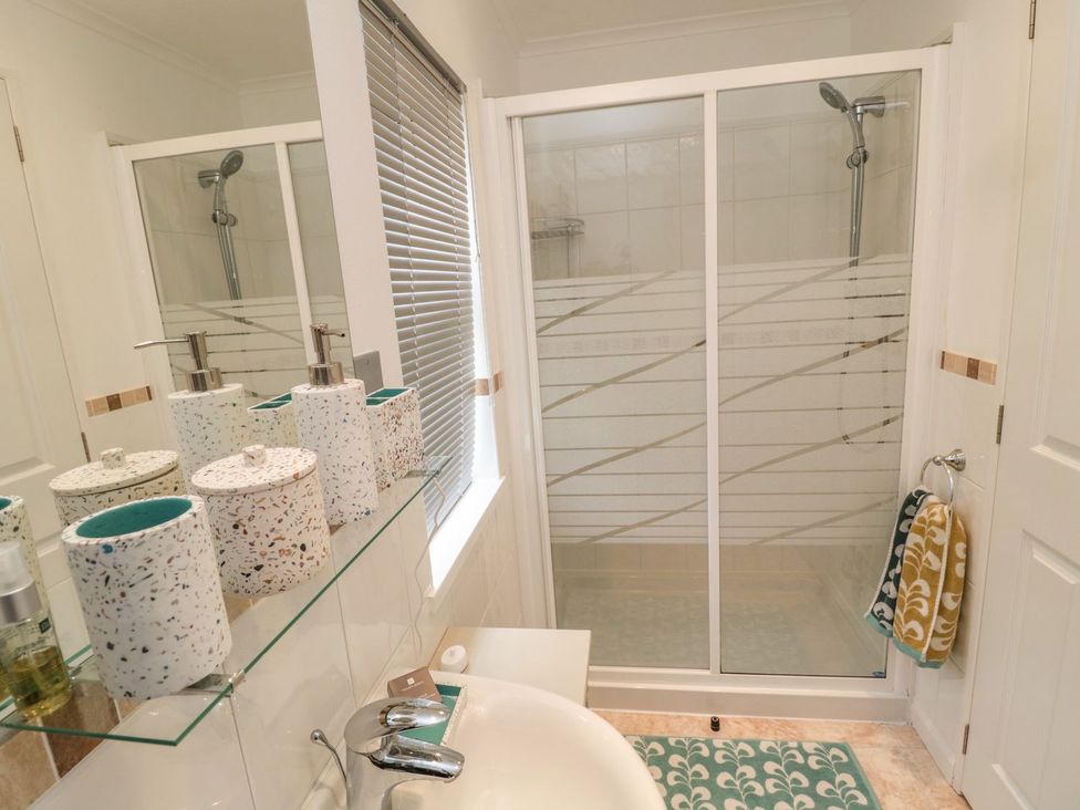 A bathroom featuring sink and shower at Nevaeh Lodge Longframlington