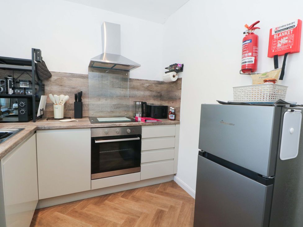 A kitchen with a refrigerator and stove at 4 Newton Terrace in Lancaster