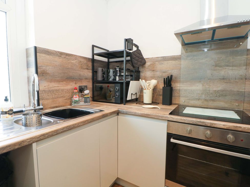 A kitchen with a sink and stove at 4 Newton Terrace in Lancaster