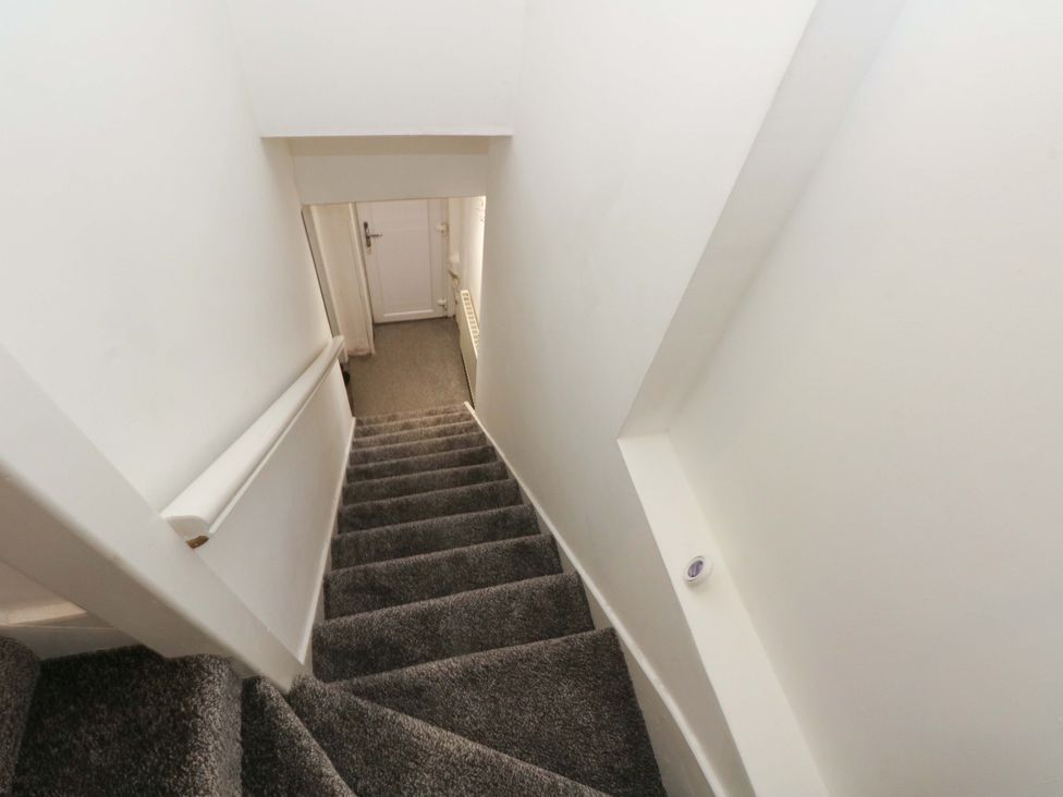 Staircase leading down to a door at 4 Newton Terrace Lancaster