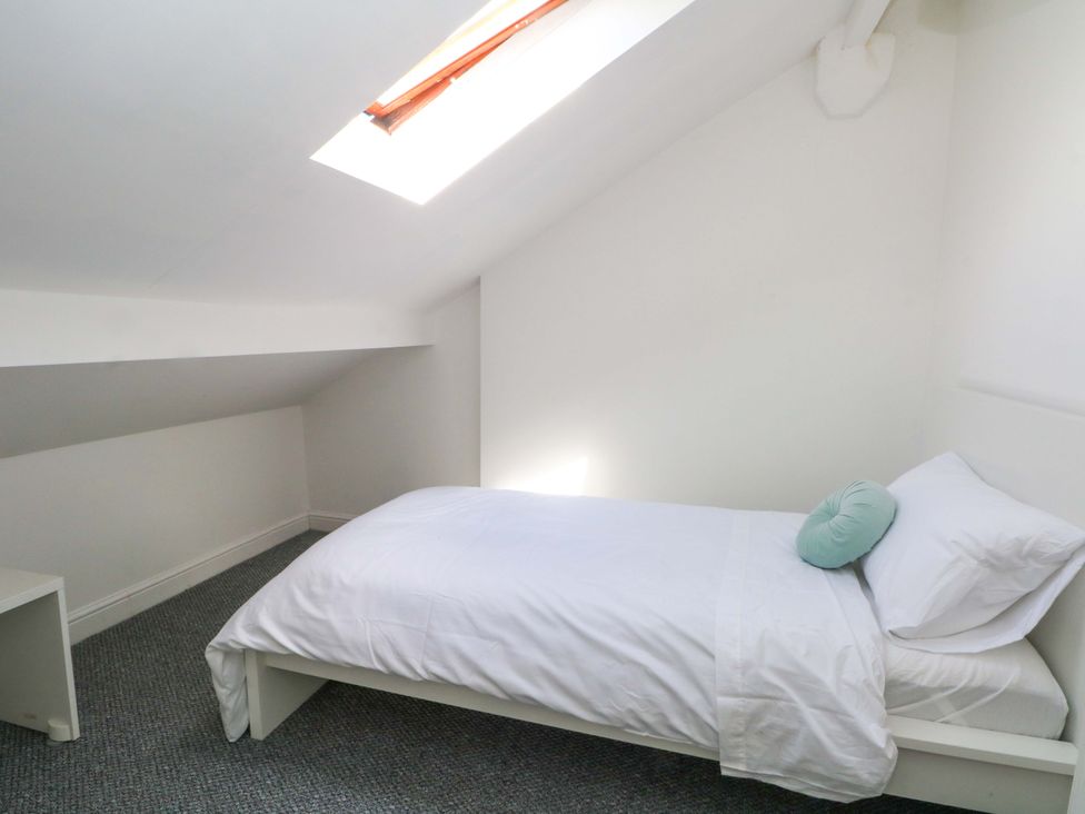 A bedroom with a bed and skylight at 4 Newton Terrace in Lancaster