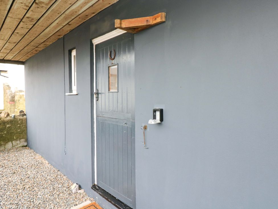An exterior view of a door and window at Red Kite Cottage in Haverfordwest