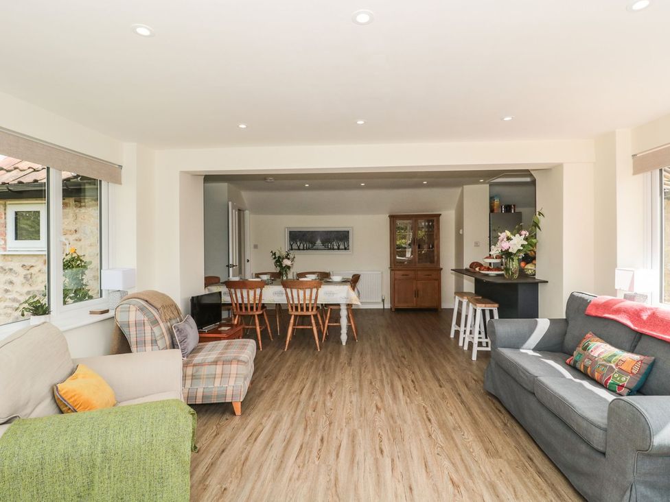 A living room with a dining area at Ammerham Farm Cottage in Ammerham near Winsham