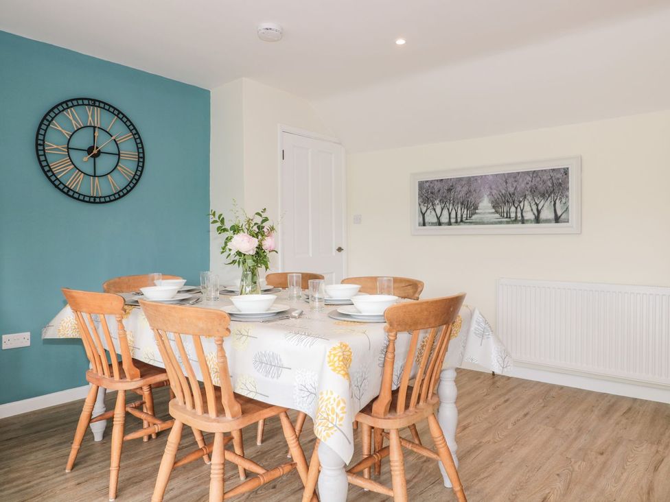 A dining room with a table and chairs at Ammerham Farm Cottage Ammerham near Winsham