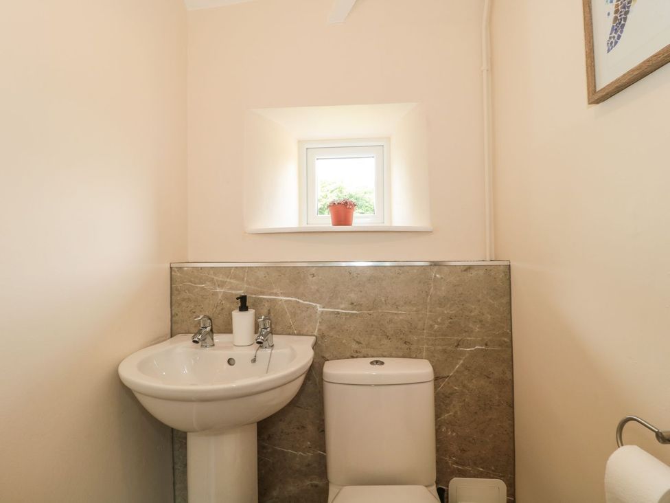 A bathroom with a sink and toilet at Ammerham Farm Cottage Ammerham near Winsham