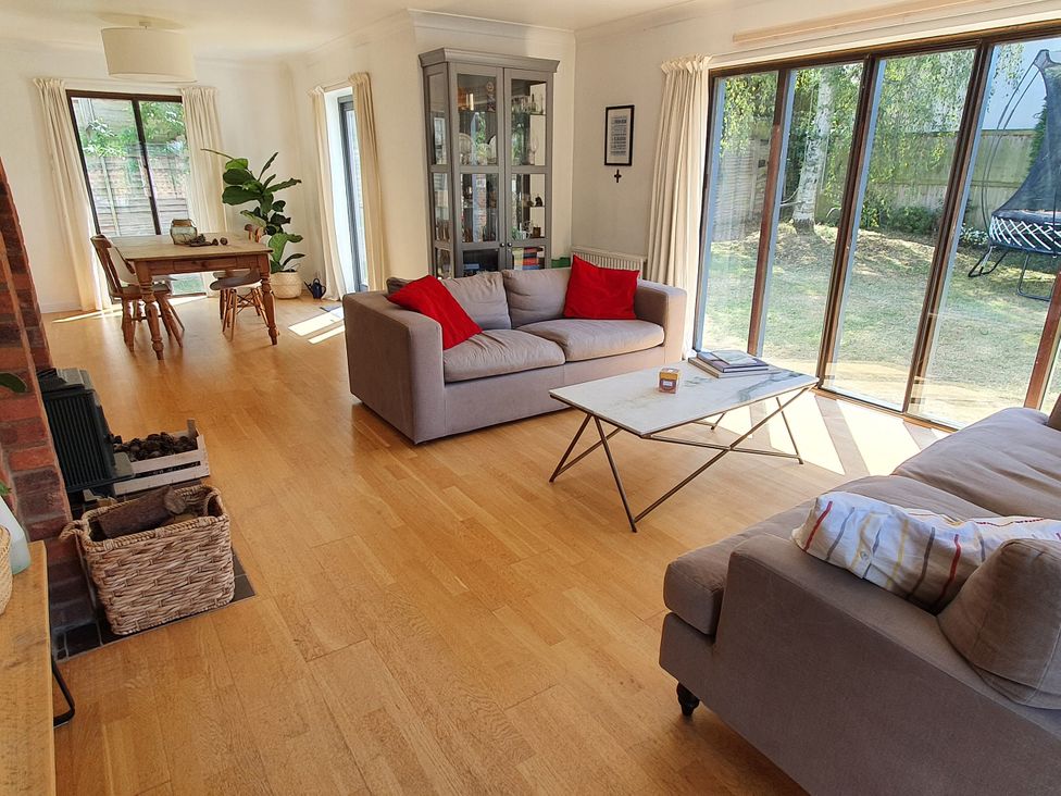 A living room with a table and chairs at Island Retreat in Colchester