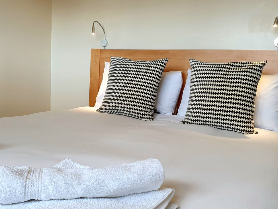 A bedroom with a bed and pillows at Island Retreat in Colchester