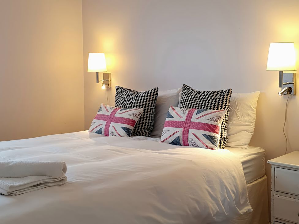 A bedroom with a bed and pillows at Island Retreat in Colchester