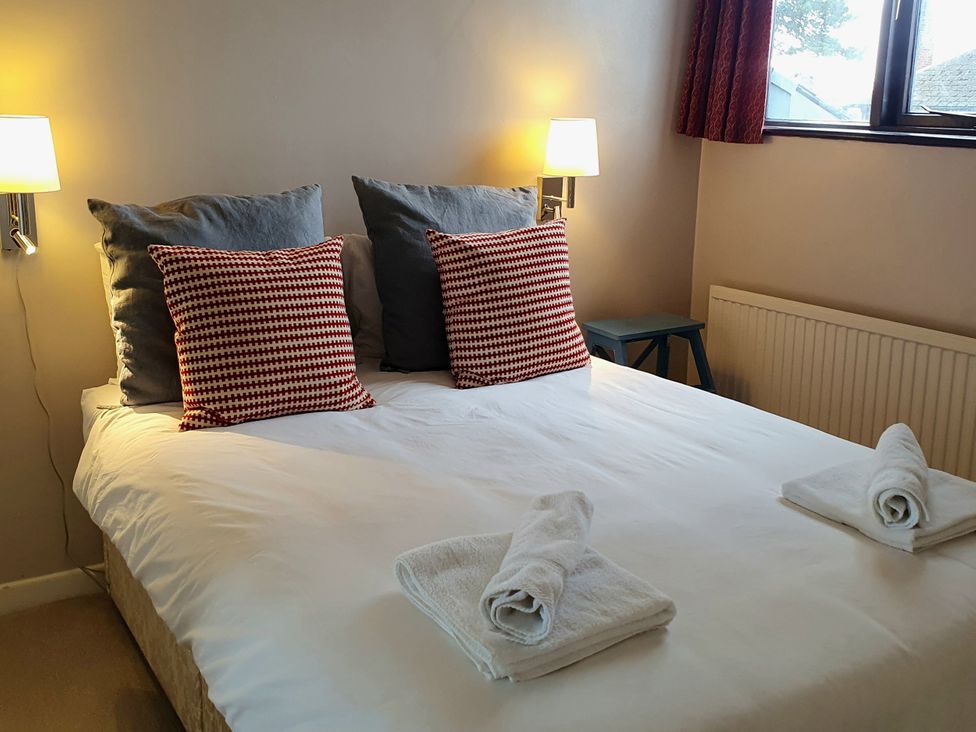 A bedroom with a bed and pillows at Island Retreat in Colchester