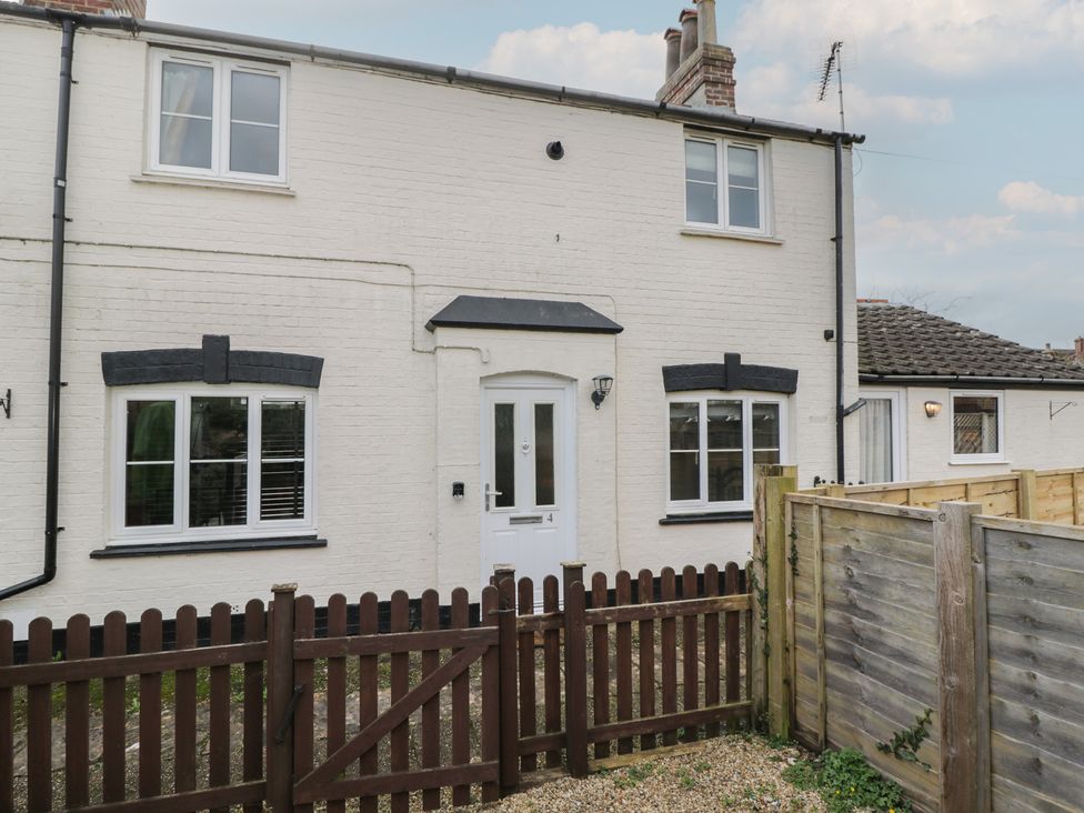 A house exterior with a fence and door at Copper Cottage in Devizes