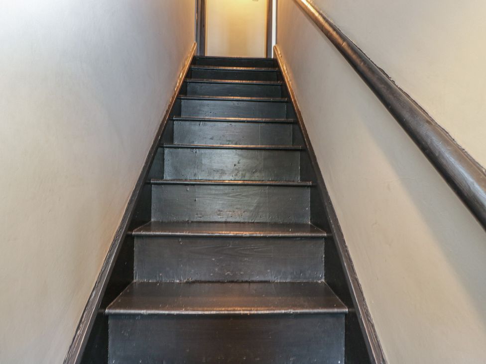 Stairs leading to the upper level at Copper Cottage in Devizes