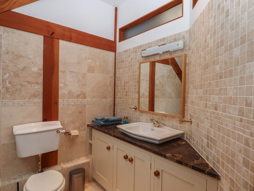 A bathroom with a toilet and sink at Pylemoor Cottage Washfield near Tiverton