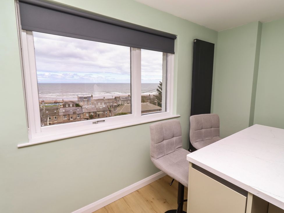 A dining room with a view of the sea at Tigh-Na-Mara Retreat 