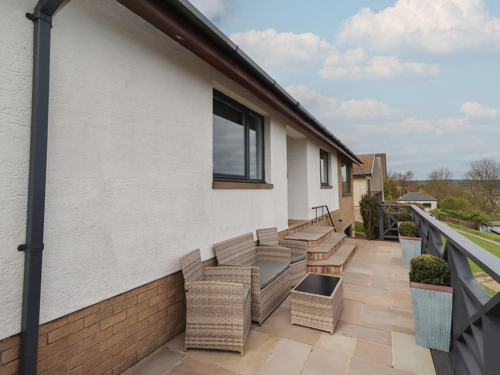 An outdoor area with seating and plants at Tigh-Na-Mara Retreat
