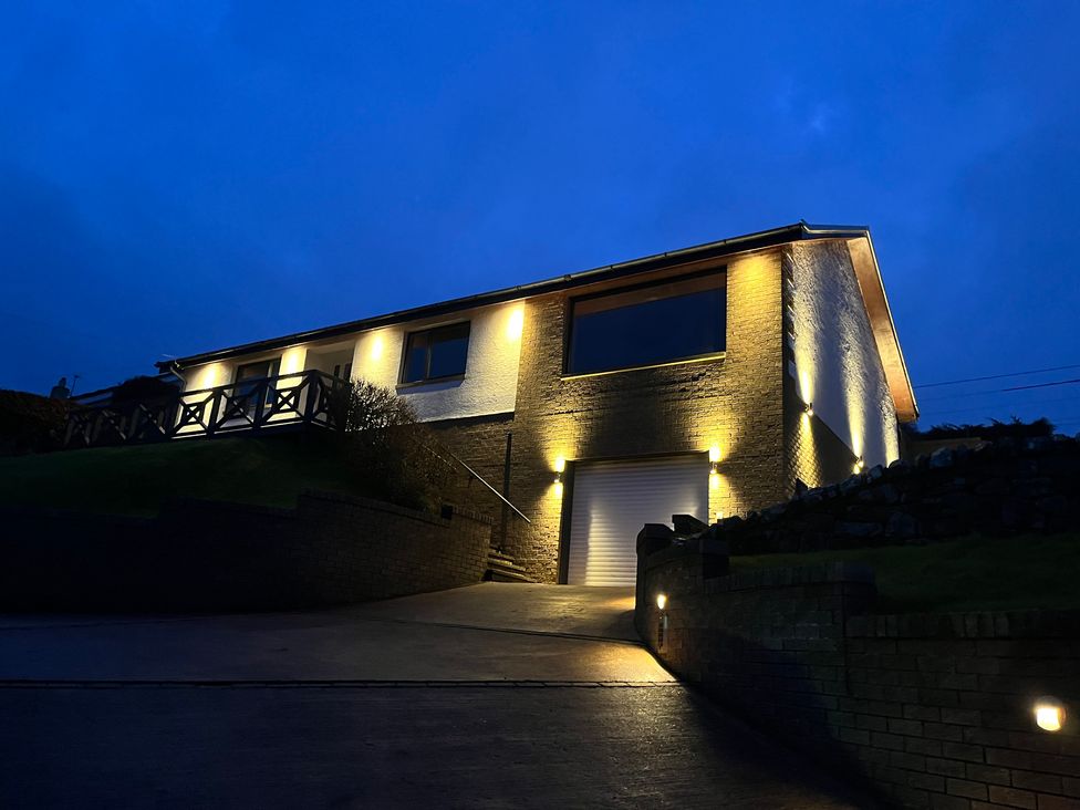 A house with outdoor lighting at Tigh-Na-Mara Retreat in Spittal