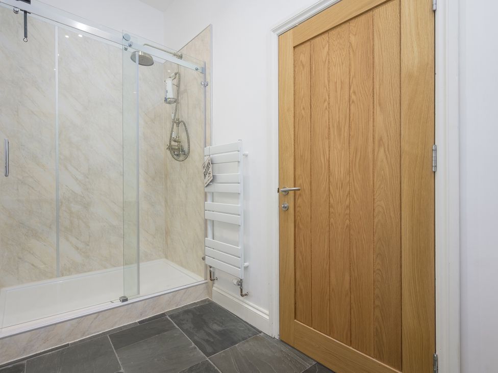 A bathroom with a shower and towel radiator at The Mayflower in Plymouth
