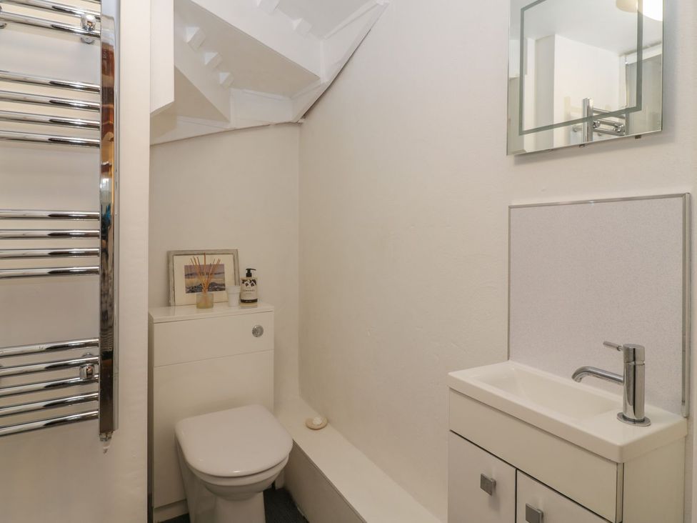 A bathroom with a sink and toilet at The Old Studio in Penzance