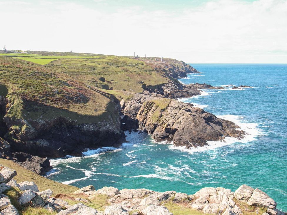 A coastline with rocks and ocean at The Old Studio Penzance